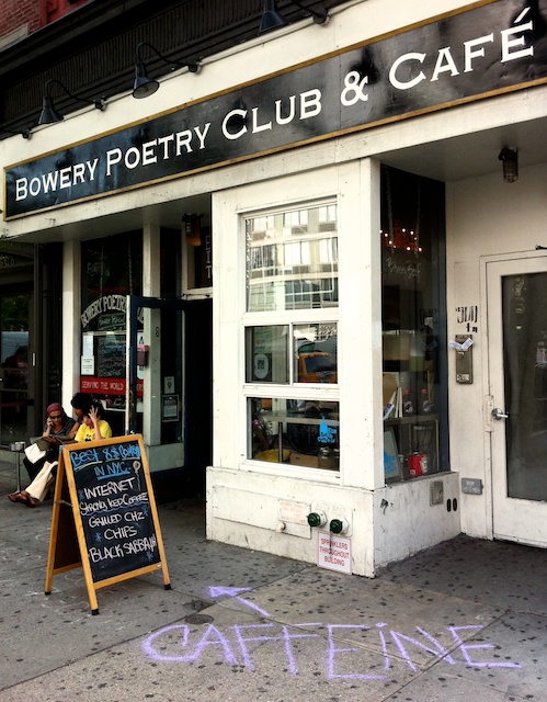 Caffeine Chalk sign on the 
pavement in front of Bowery Poetry Club & Cafe, Manhattan, New York 2011